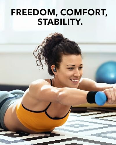 Woman exercising with weights on a mat.