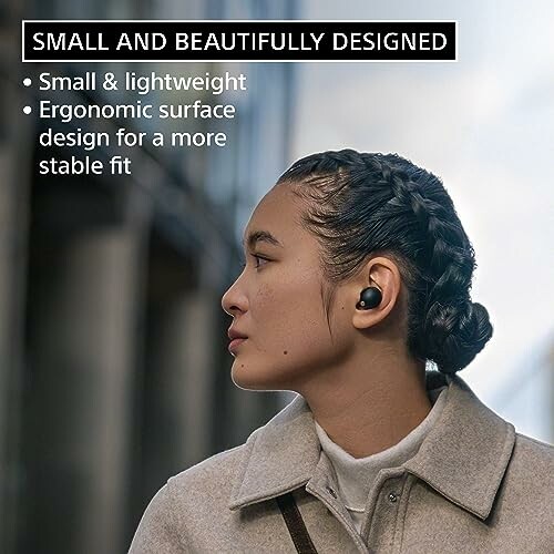 Woman wearing earbuds, emphasizing small and lightweight design.